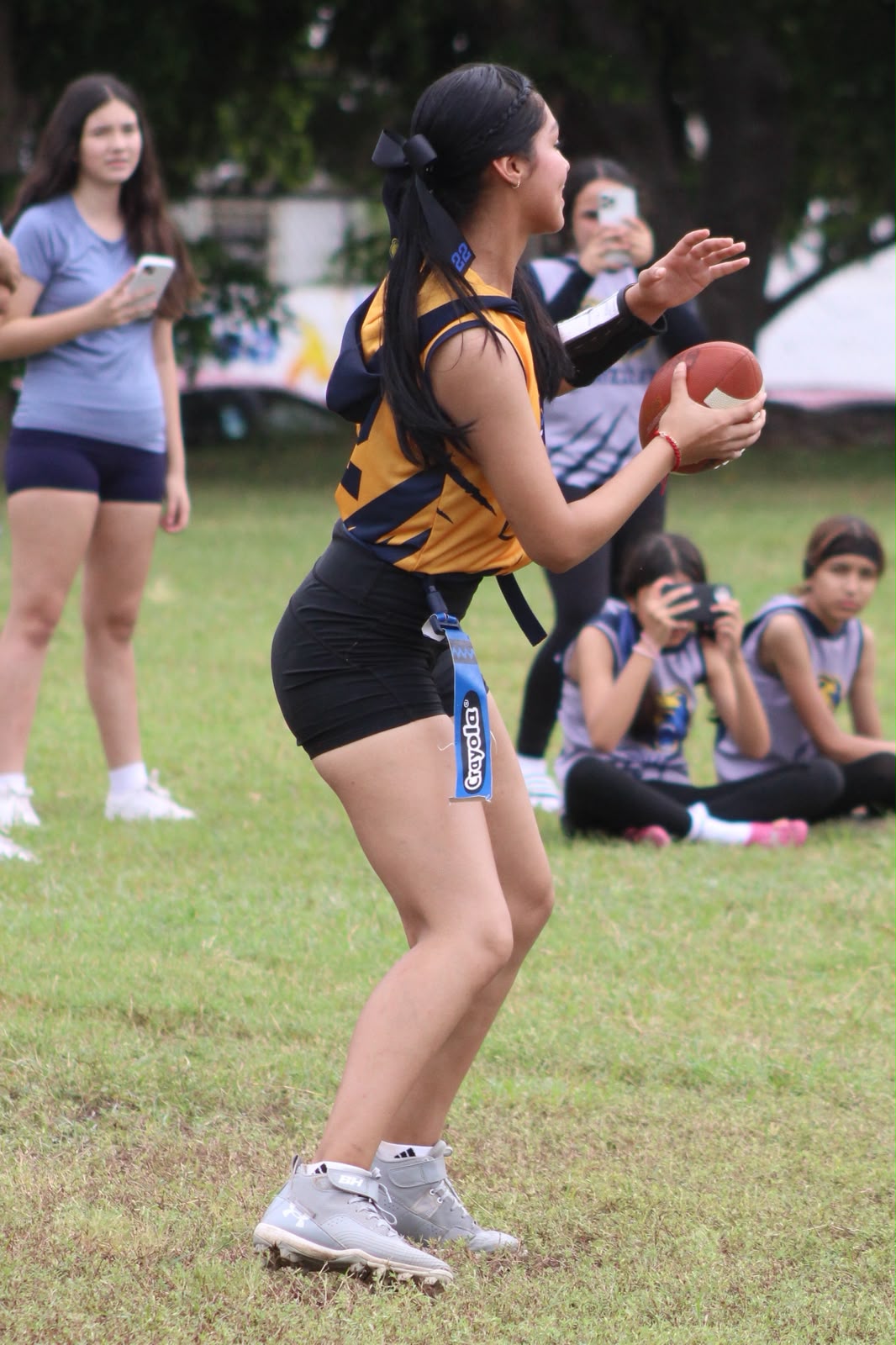 Keira Araiza throwing a pass at quarterback